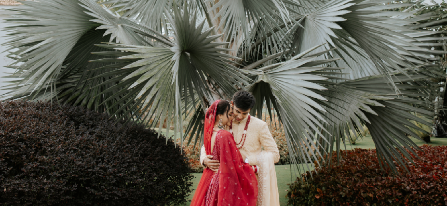 Bride and groom walking on Dubai desert dunes at sunset — cinematic wedding photo by BITM