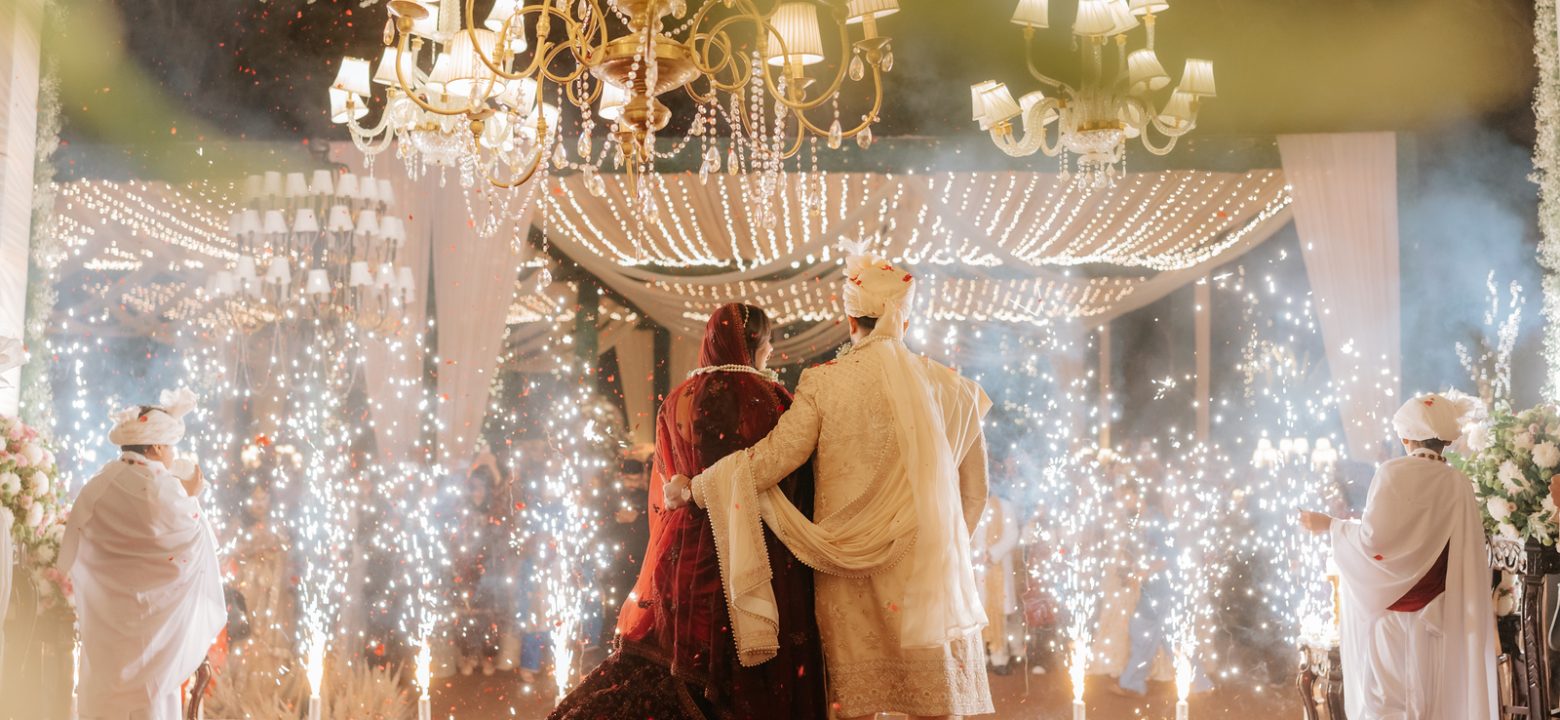 Professional wedding photographer capturing romantic moments of a bride and groom during a wedding ceremony
