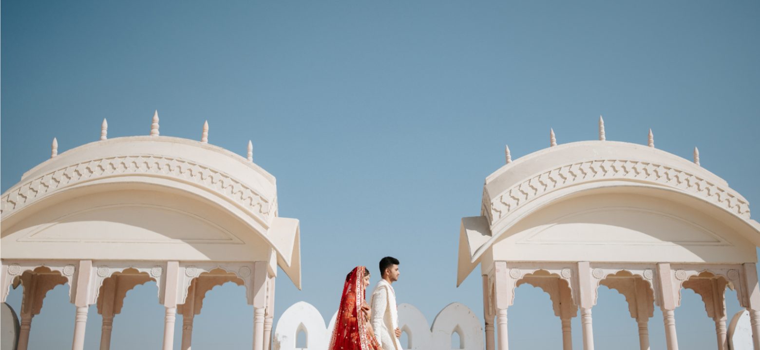 A professional wedding photographer from Beats in the Moment captures a couple sharing an intimate, candid moment during their wedding day.
