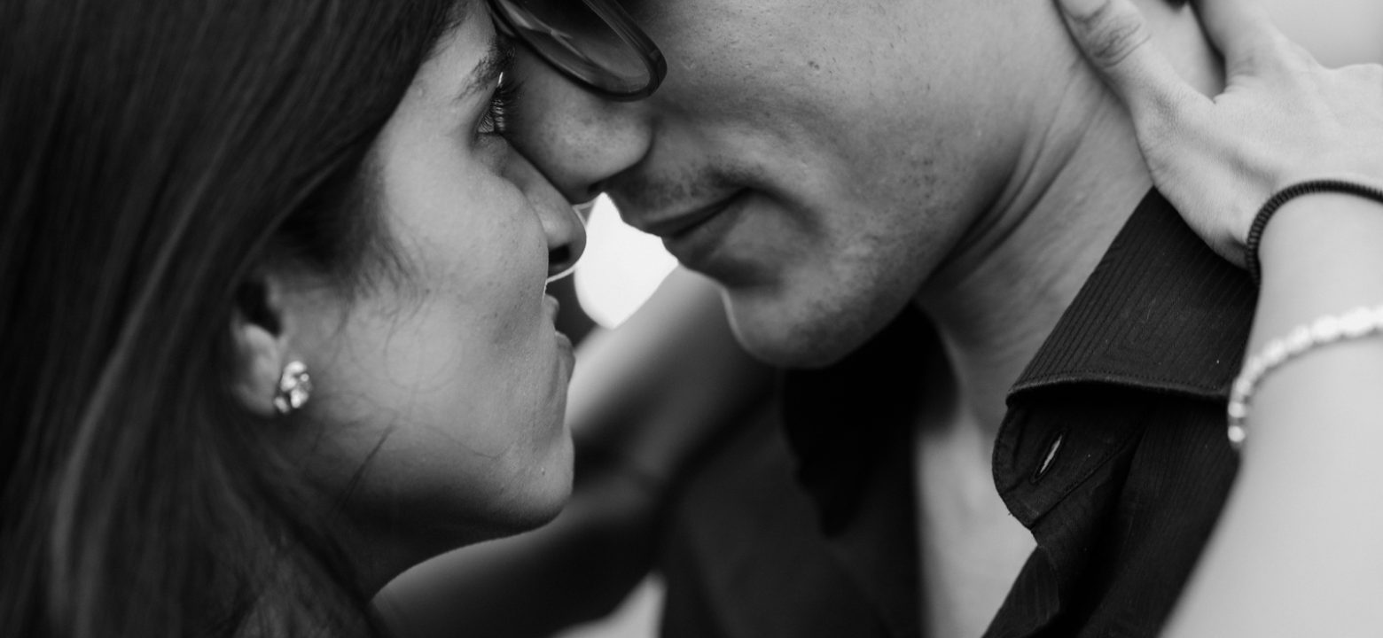 Couple engagement photoshoot in a romantic garden setting